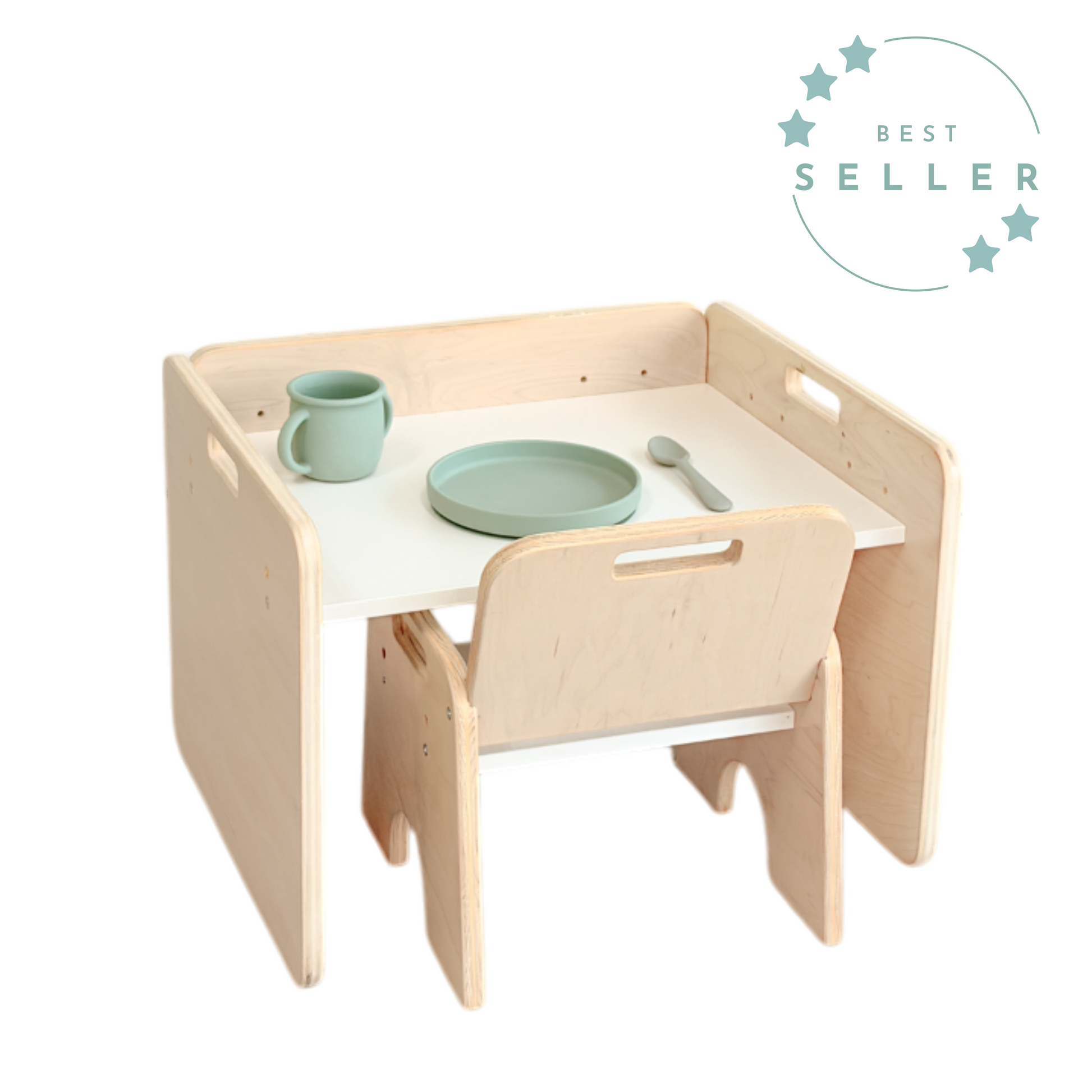 Montessori weaning table and chair set made from plywood with a white tabletop. Perfectly sized for toddlers to eat, play, or work independently. Includes a sage green toddler plate, cup, and spoon to support self-feeding and autonomy, from Sapiens Child made in Canada.