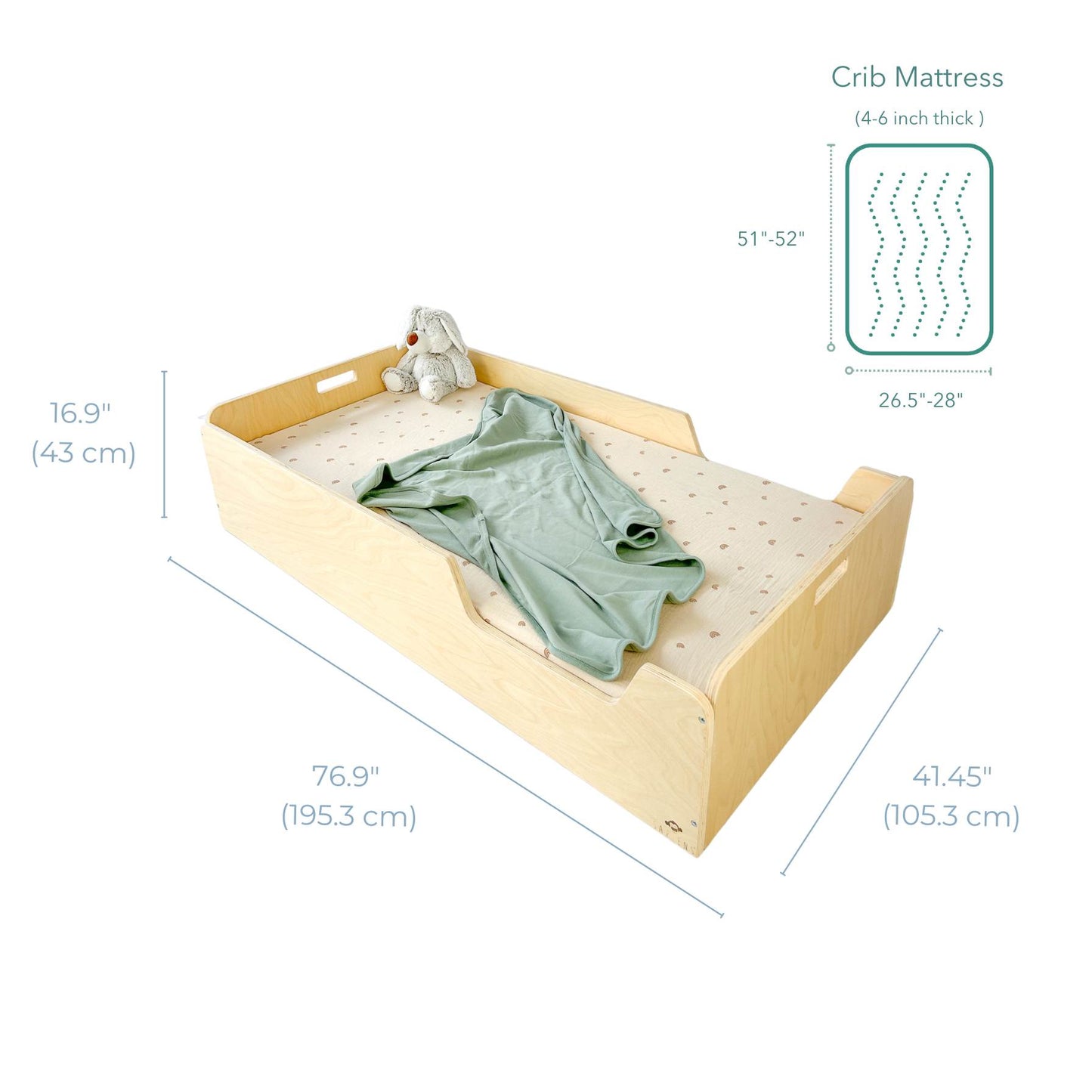 Enclosed Montessori-style toddler bed with labeled dimensions: 76.9" (195.3 cm) long, 41.45" (105.3 cm) wide, and 16.9" (43 cm) high. Designed to fit a crib mattress (4-6 inches thick), this floor bed promotes safe, independent sleep. Features built-in handles, breathable perforations, and a minimalist aesthetic with a sage green blanket and plush bunny.