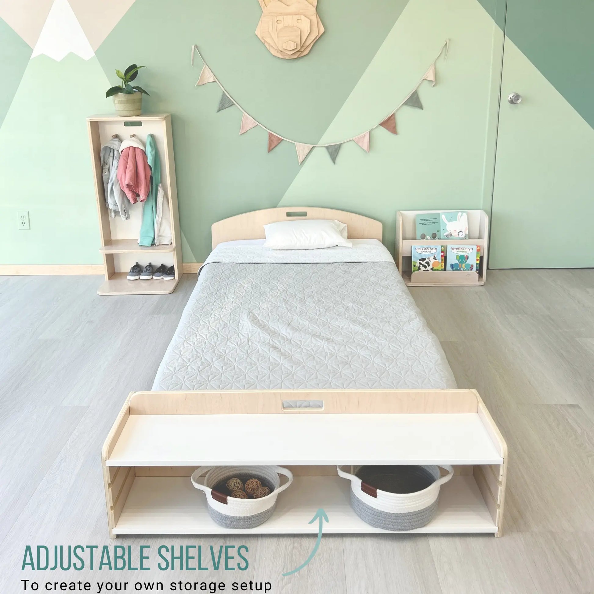 Minimalist twin bed crafted from maple plywood, featuring an integrated storage bench with adjustable shelves. Designed for Montessori-inspired bedrooms, this bed promotes independence and organization. Styled with soft gray bedding, woven baskets, and child-friendly storage solutions, it creates a functional and inviting sleep space.