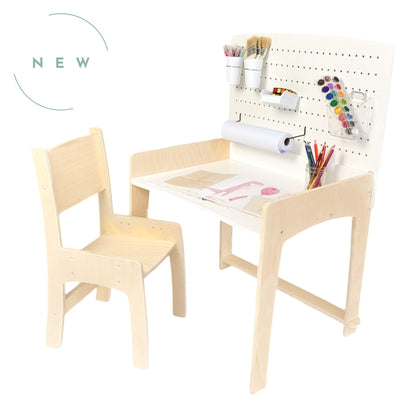 Lumen Big Kid Desk – adjustable wooden desk and chair set for kids, designed for ages 4.5 to 10+. Features a pegboard for storage, a roll of paper for drawing, and a spacious work surface. Made in Canada with Montessori-inspired design, promoting creativity and independence.