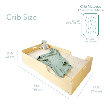 Crib with mattress dimensions labeled on a white background