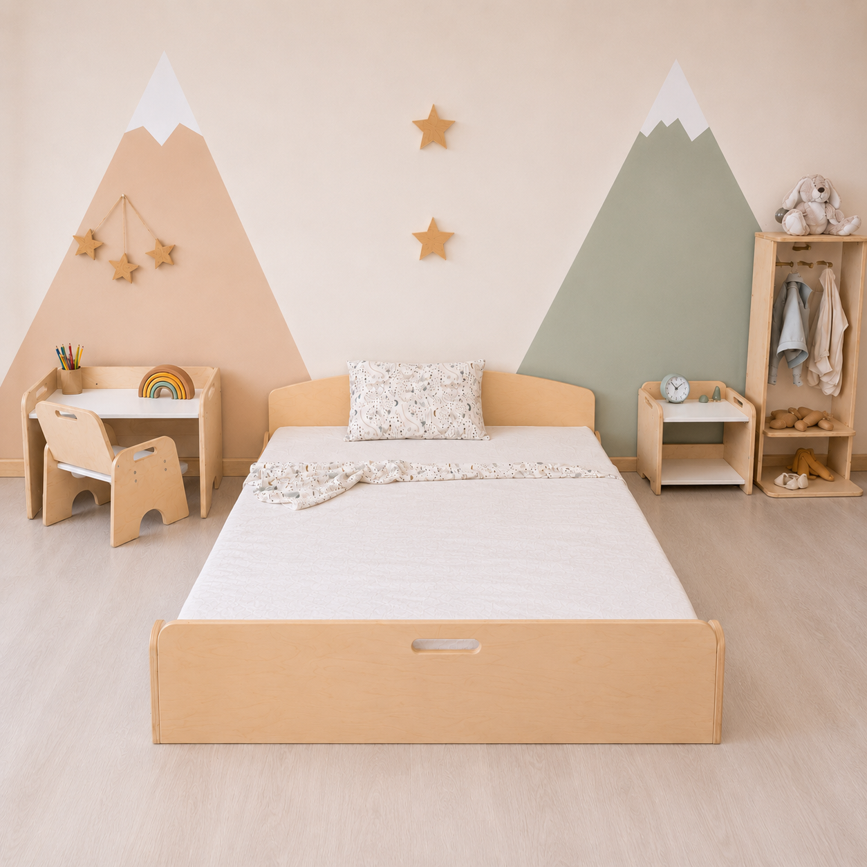 Children's bedroom with wooden bed, desk, and shelves against a wall with mountain decorations.